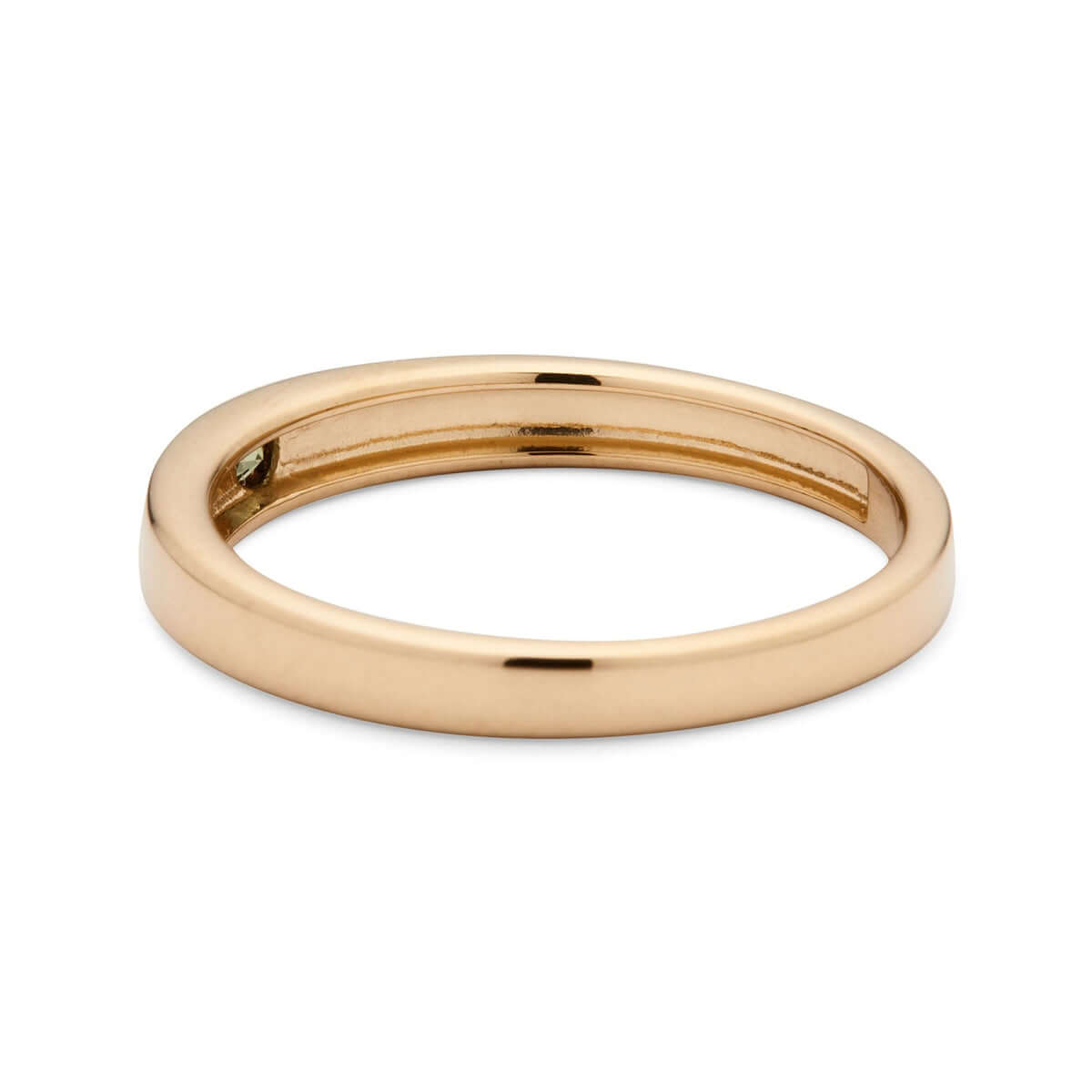 Side view of a gold signet ring, with a solitary Australian sapphire