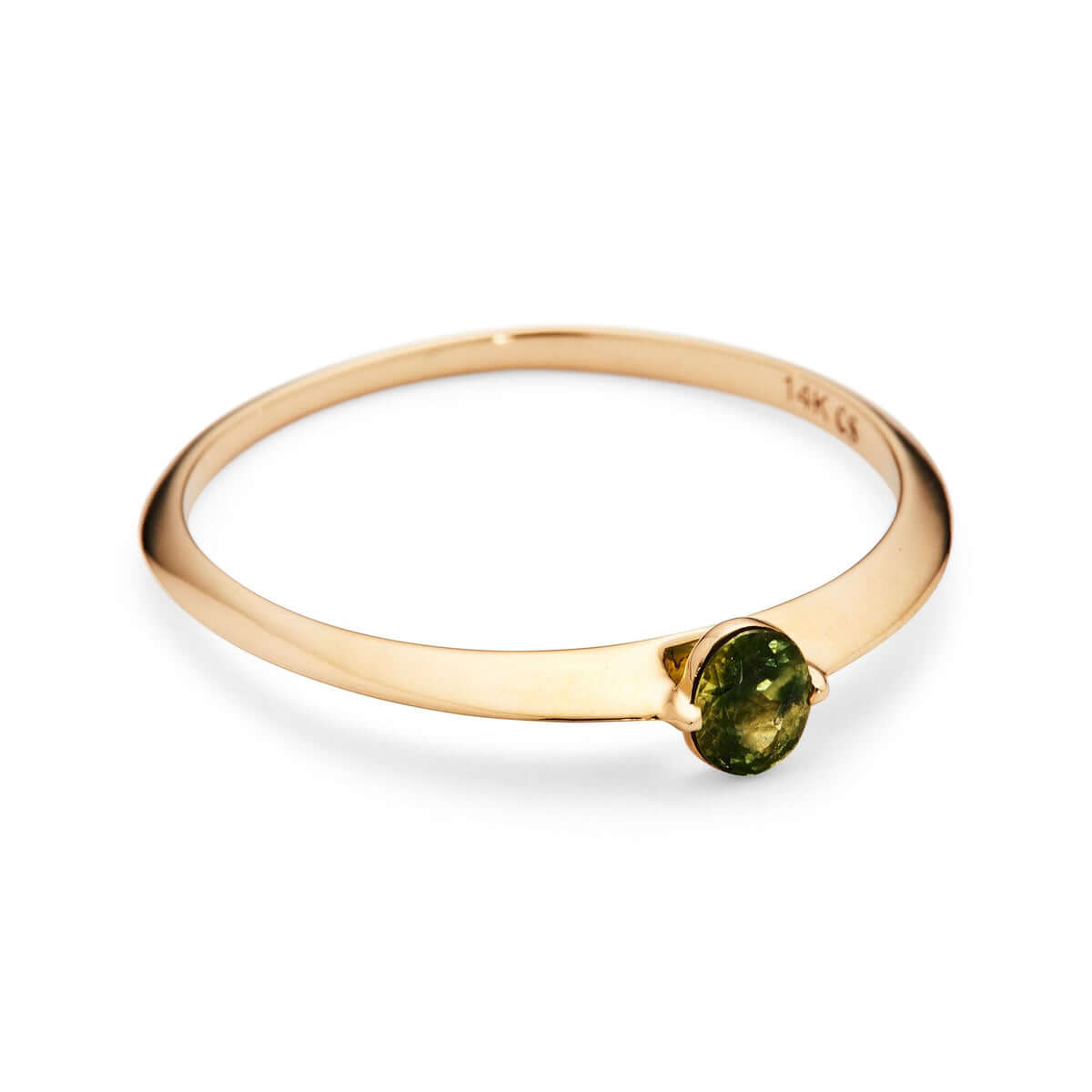 Top view of the 'Floe' ring on a white surface, focusing on the oval Australian sapphire set in a thin gold band.