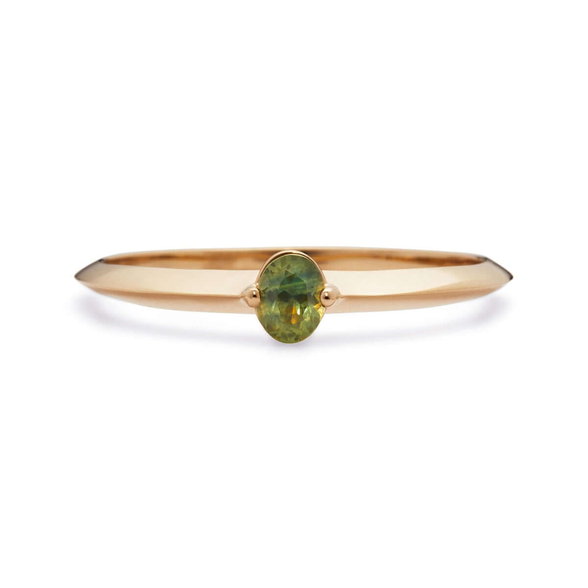 An oval Australian sapphire ring, along a knife edge band.