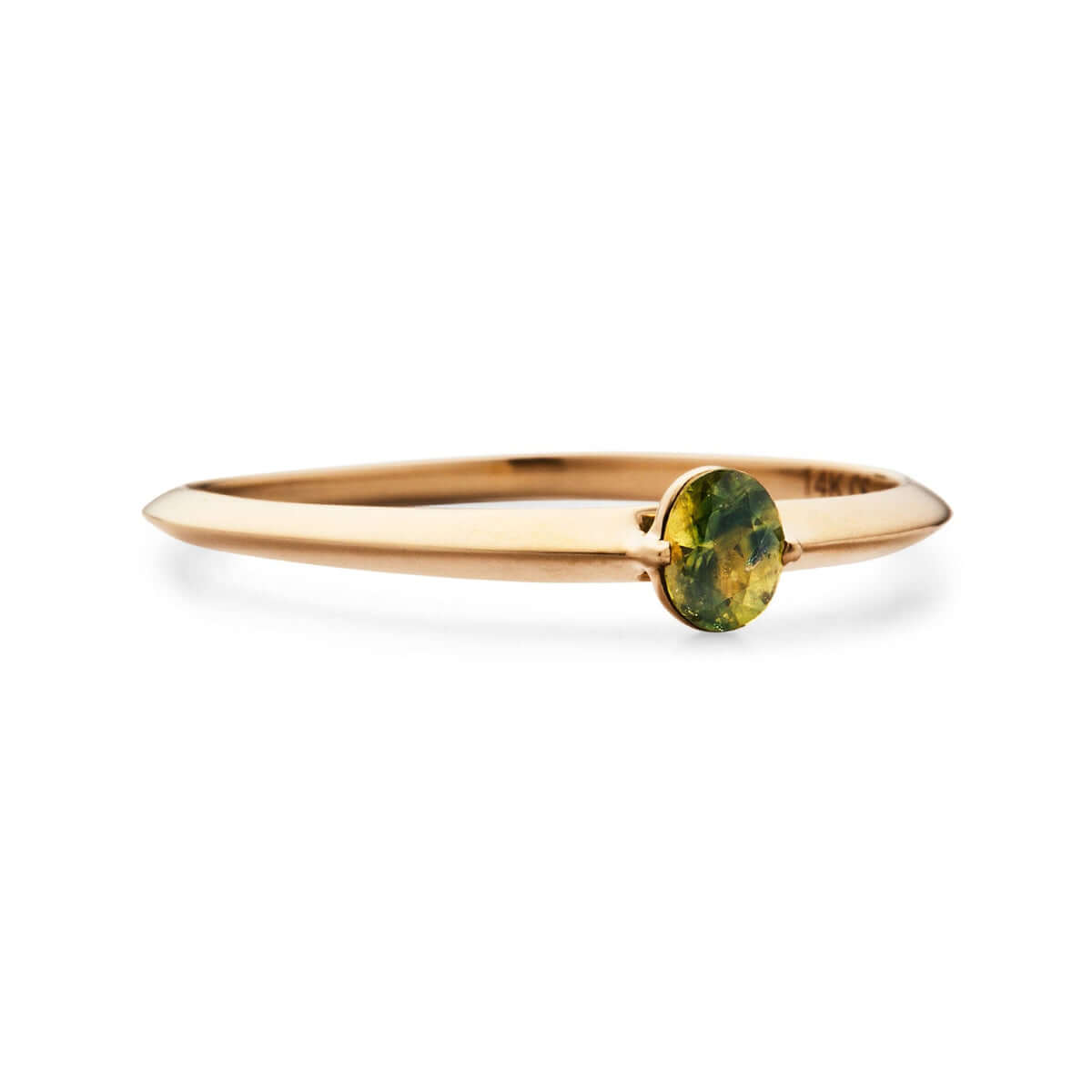 Close-up view of a dainty gold band featuring a Australian sapphire gem.