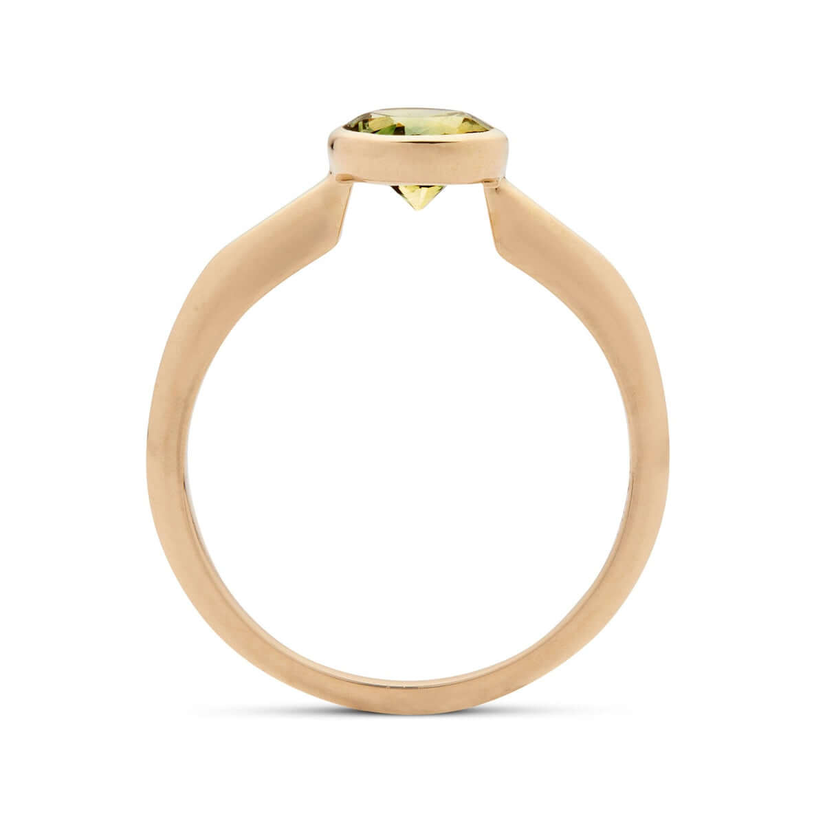 A side view of the 'Lou' ring, featuring a bezel-set bicolor sapphire nestled between angular details.
