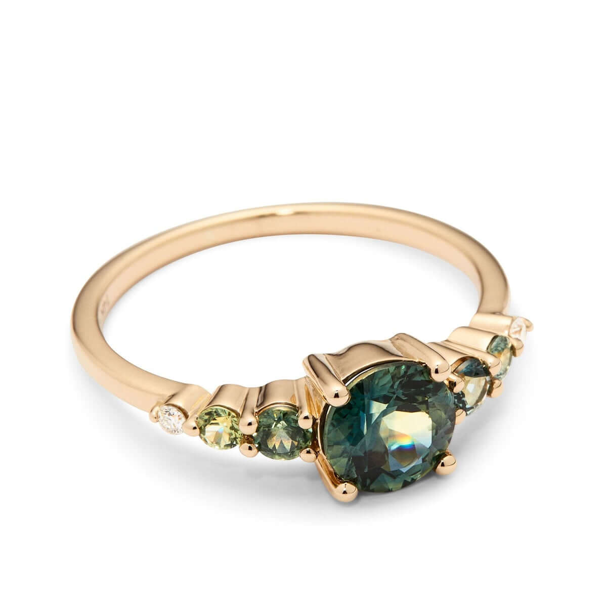 The side angle of a yellow gold ring showcasing a large Australian sapphire with smaller sapphires and diamond.