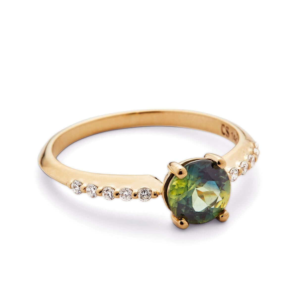A top-down view of a yellow gold ring spotlighting a bi-color Australian sapphire with a linear diamond arrangement on a knife-edge band.