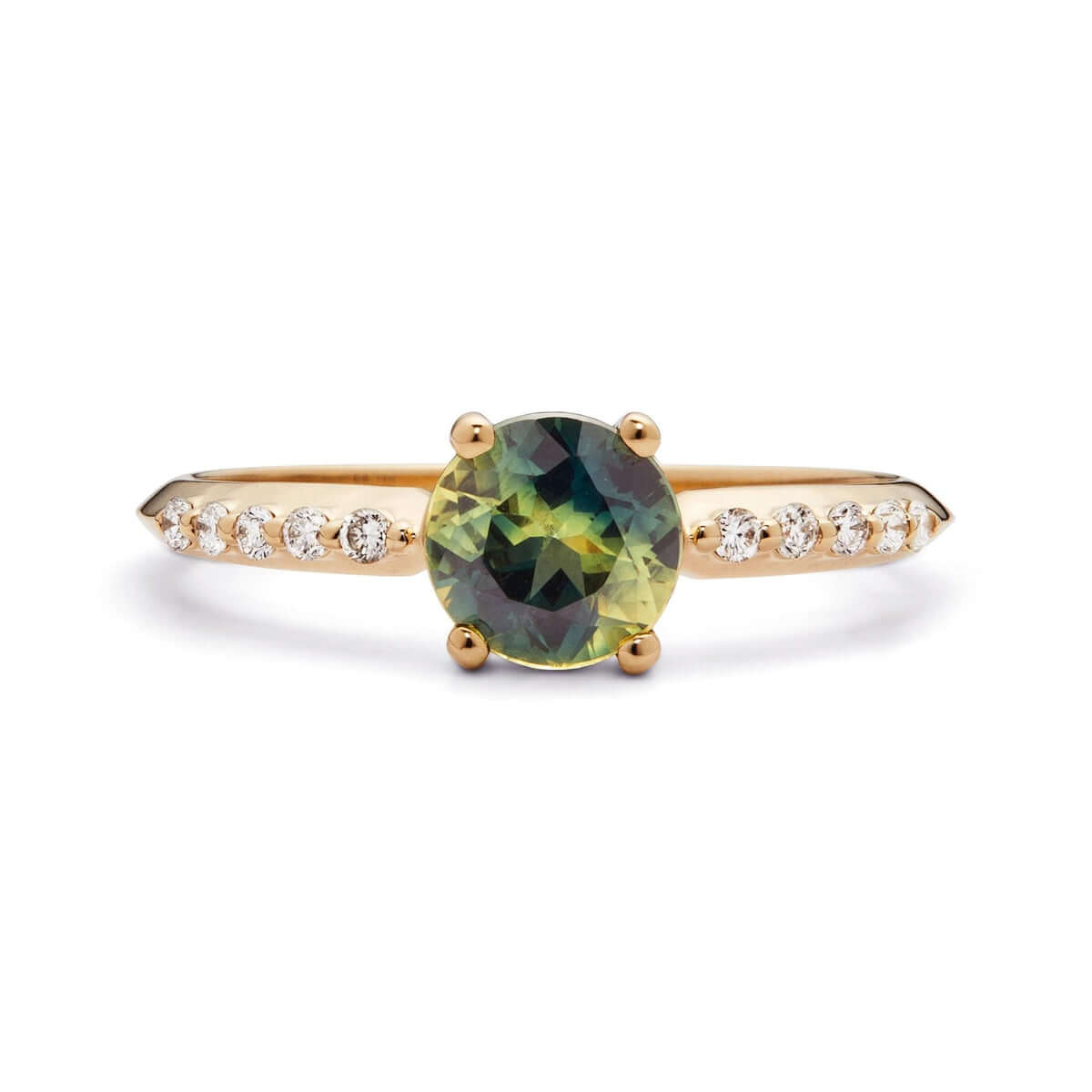A profile view of a yellow gold ring with a bi-color Australian sapphire encircled by ten diamonds on a sophisticated knife-edge band.