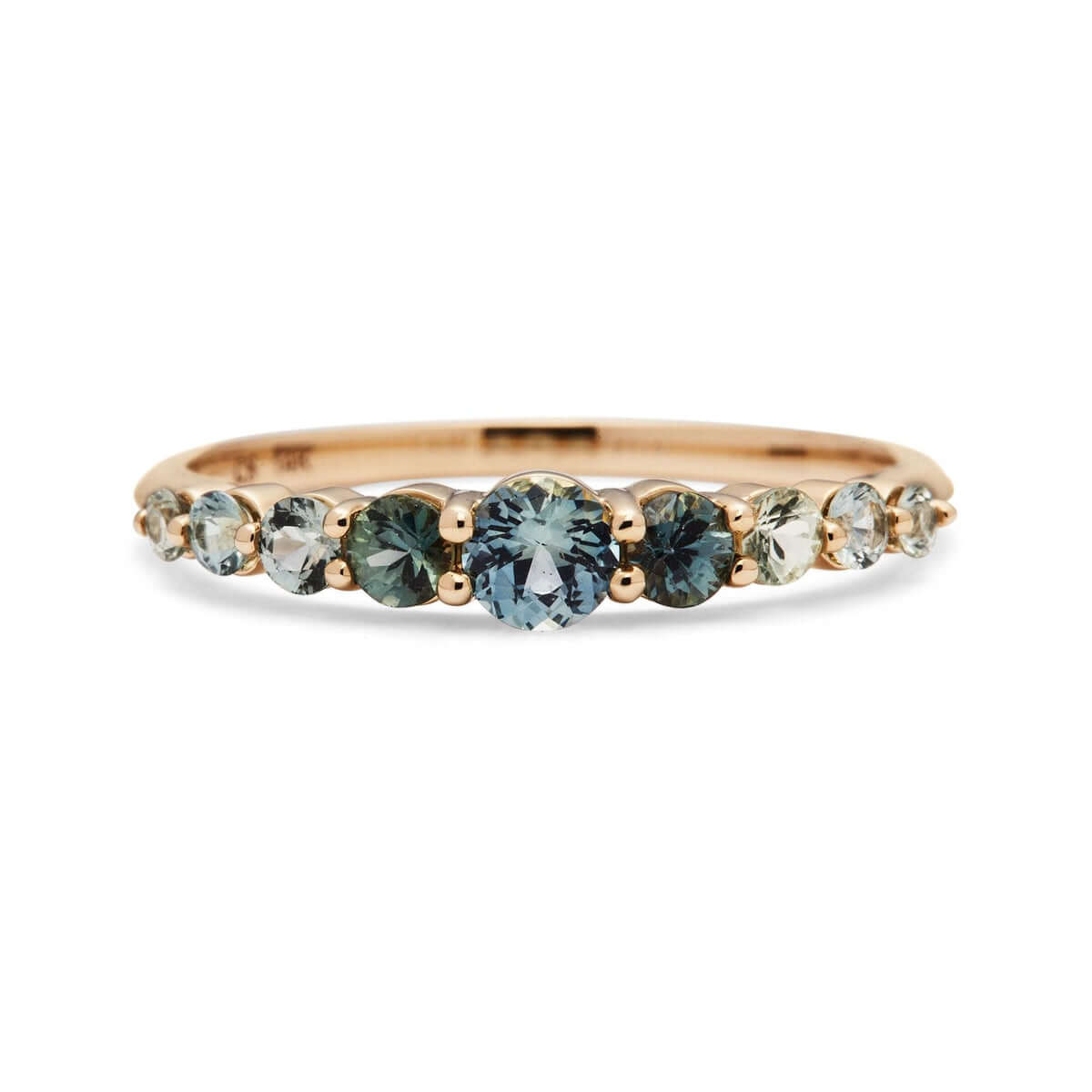 Close-up of Edie Australian Sapphire Ring showcasing a gradient of blue and green sapphires set in recycled 14k gold.