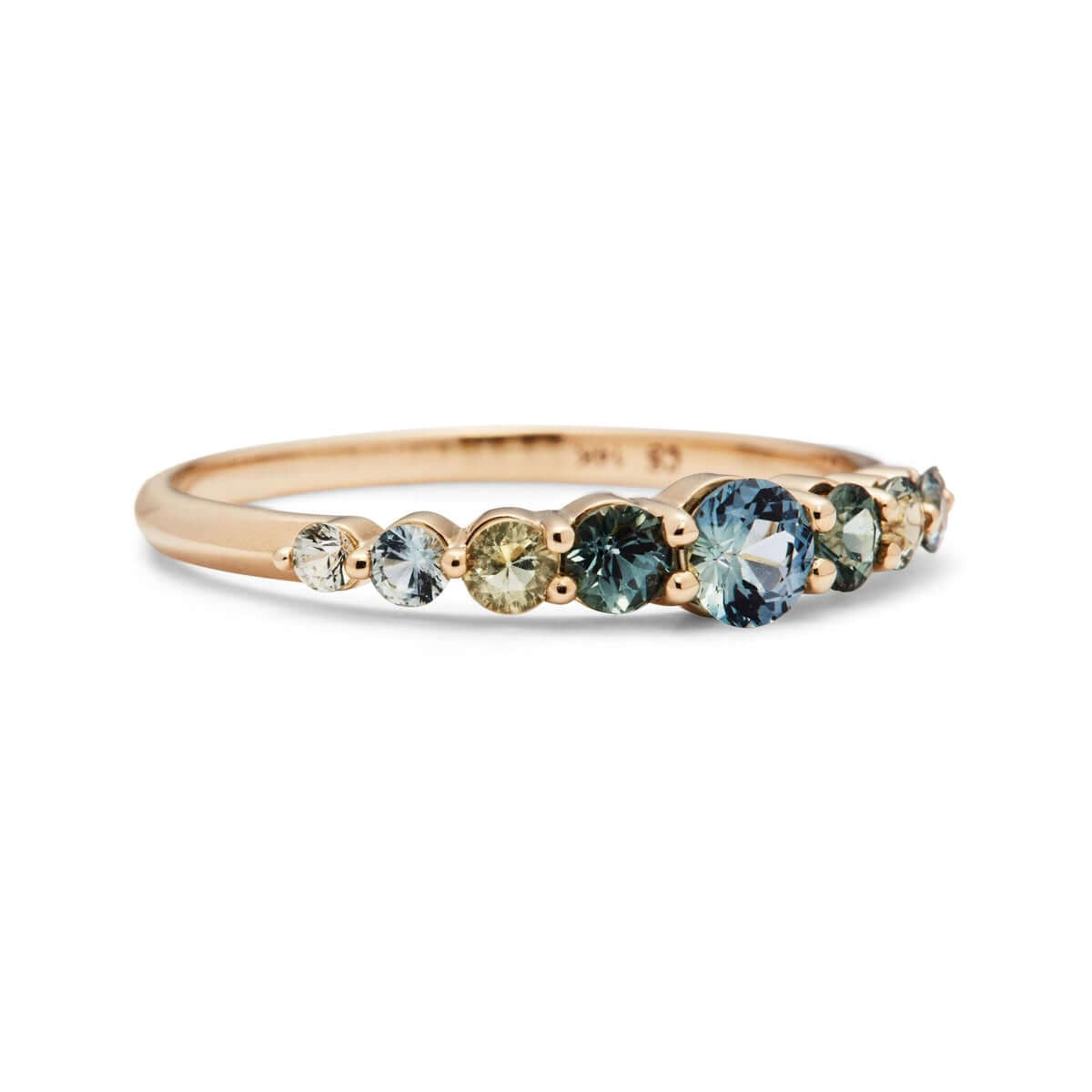 Edie Australian Sapphire Ring on a plain background, featuring responsibly sourced sapphires in hues of blues and greens.