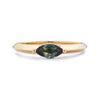 A yellow gold ring with a marquise-cut Australian sapphire on a white background